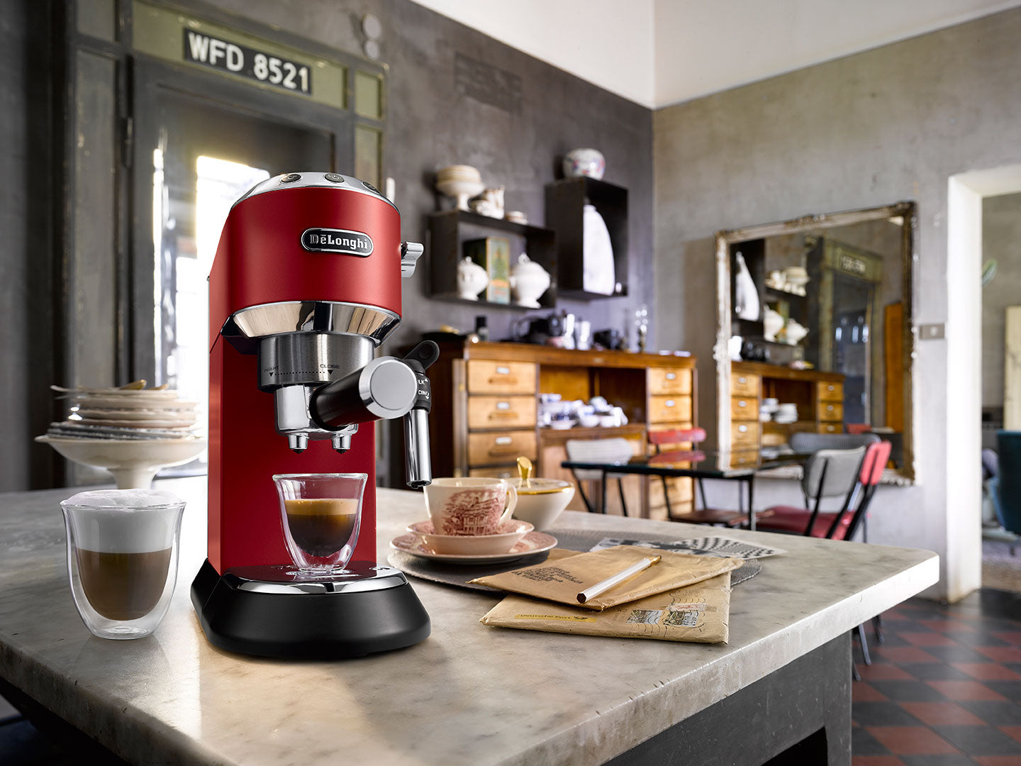 De'longhi Dedica Ec685 coffee machine with its elegant design and distinctive red color